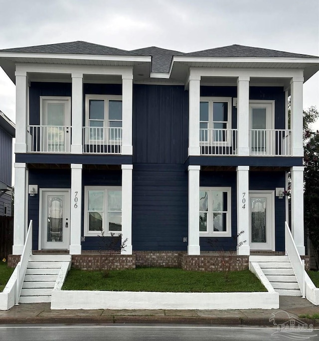 504 N Devilliers St Unit A & B, Pensacola, FL 32501 - view of front of home with a balcony, covered porch, stairway, and roof with shingles
