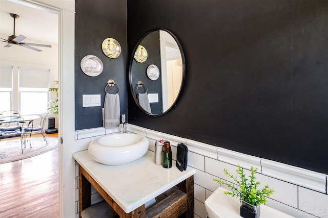 bathroom with ceiling fan, sink, and toilet