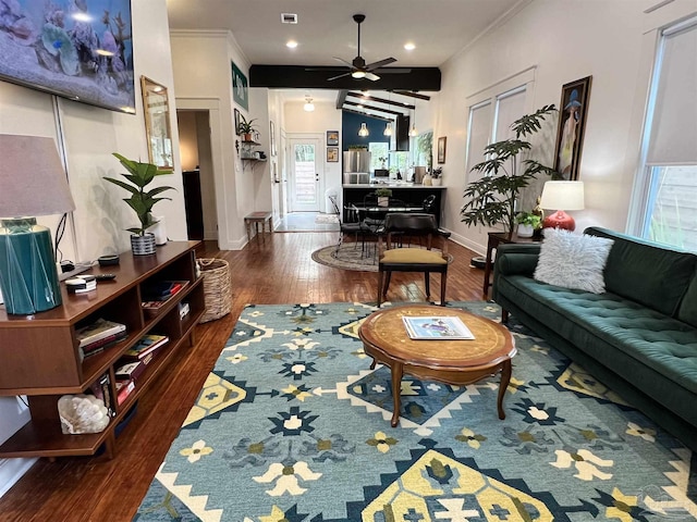 living room with ceiling fan, dark wood-type flooring, and ornamental molding