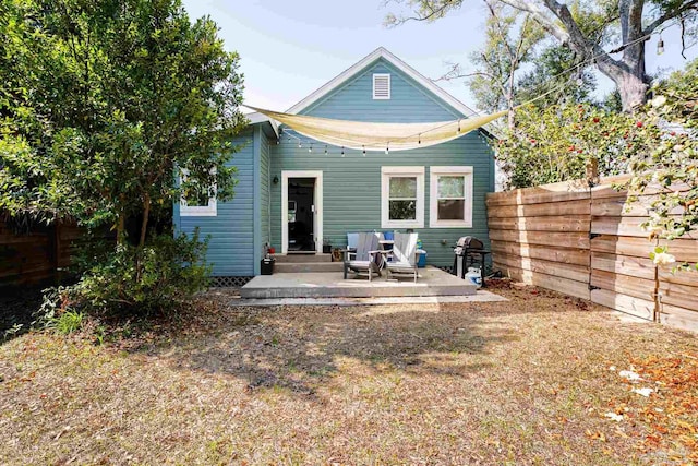 rear view of house with a patio