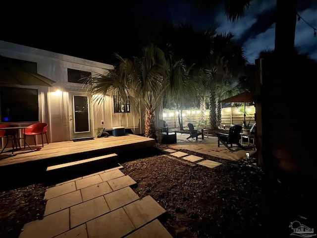 patio at night with a deck