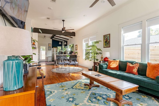 living room with ceiling fan, lofted ceiling, and hardwood / wood-style flooring