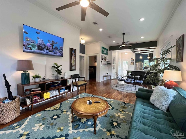 living room featuring wood-type flooring, ceiling fan, and crown molding