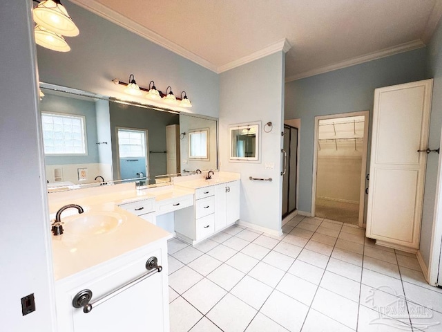 bathroom with vanity, ornamental molding, and tile patterned floors