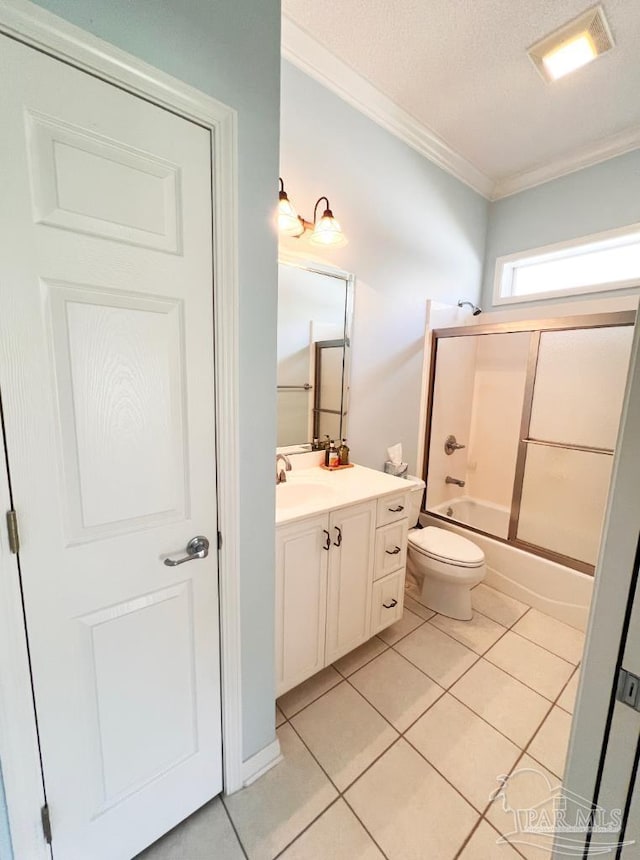 full bathroom featuring crown molding, toilet, vanity, bath / shower combo with glass door, and a textured ceiling