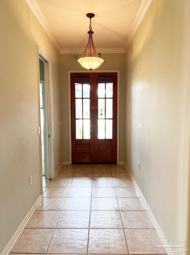 doorway featuring light tile patterned floors, a textured ceiling, crown molding, and french doors