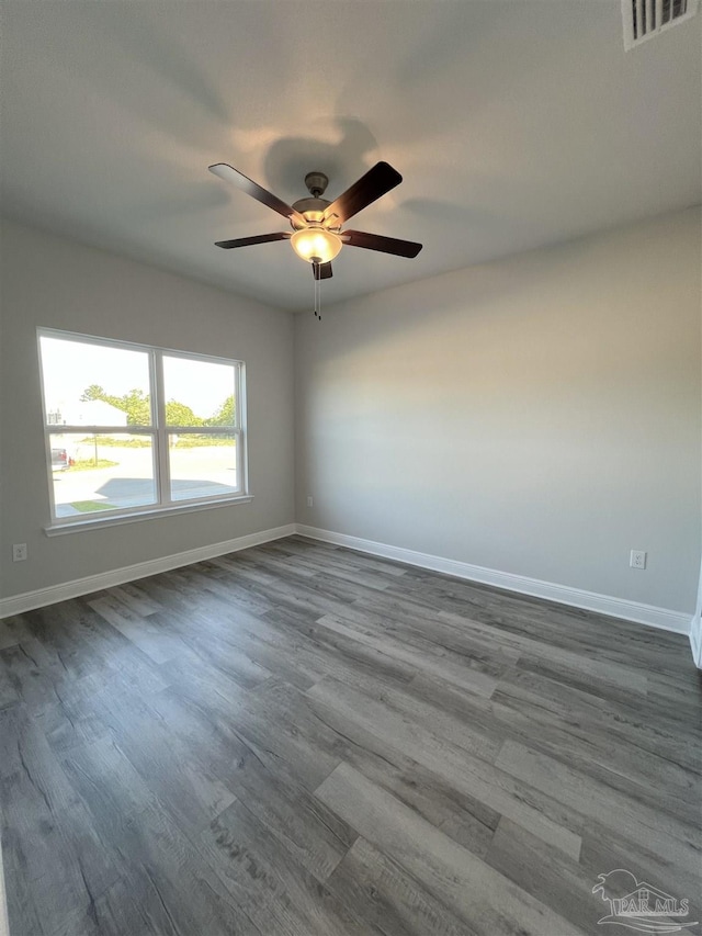 spare room with wood-type flooring and ceiling fan