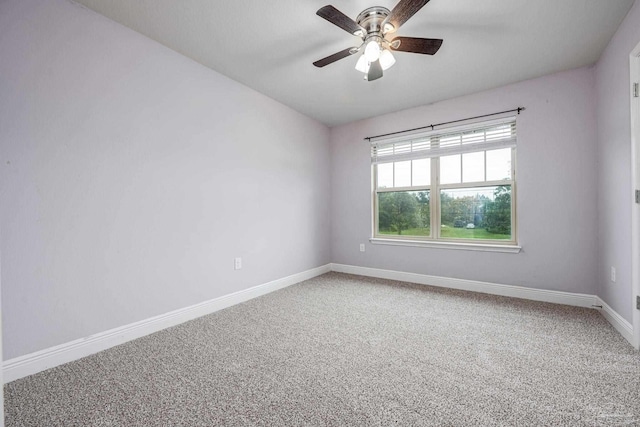 empty room featuring carpet and ceiling fan