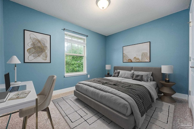 1885 Natures Way, Gulf Breeze, FL 32563 - bedroom with baseboards, a textured ceiling, and an office area