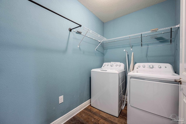 1885 Natures Way, Gulf Breeze, FL 32563 - washroom with washing machine and dryer, dark wood finished floors, and baseboards
