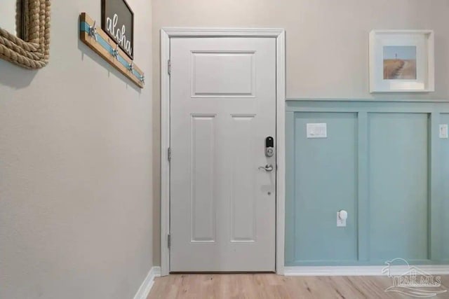 doorway with light hardwood / wood-style flooring