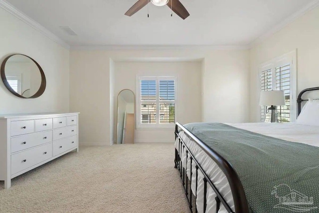 carpeted bedroom with multiple windows, ornamental molding, and ceiling fan