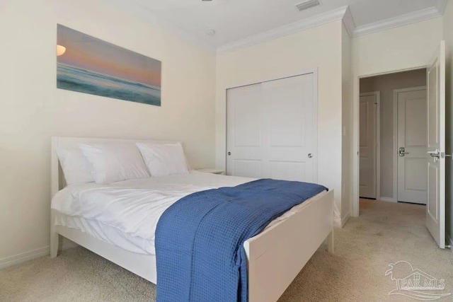 bedroom with light carpet, a closet, and ornamental molding