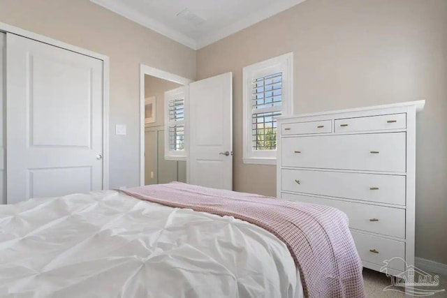 bedroom with crown molding