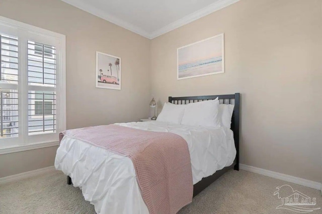 carpeted bedroom featuring crown molding