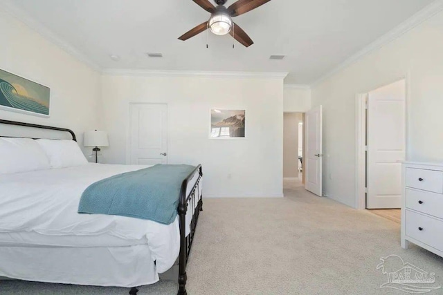 carpeted bedroom featuring ceiling fan and crown molding