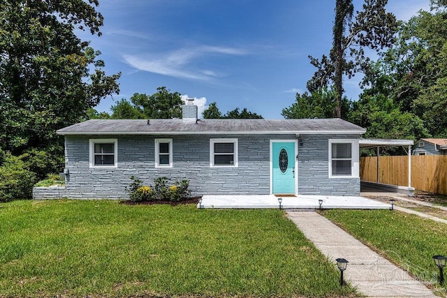 ranch-style home featuring a front yard