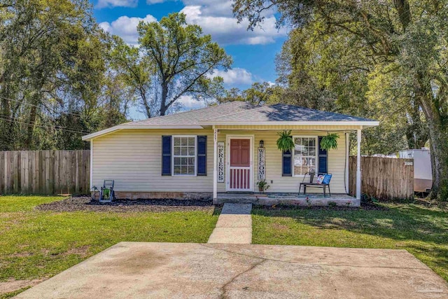 3985 Whitehall Dr, Pace, FL 32571 - bungalow-style home featuring fence, a front lawn, and a porch