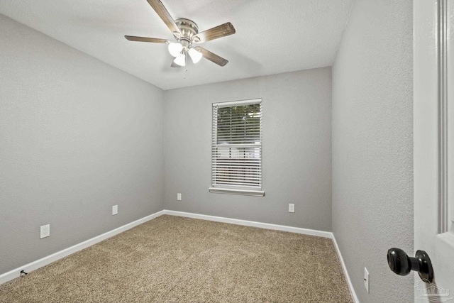 3985 Whitehall Dr, Pace, FL 32571 - carpeted empty room featuring baseboards, a textured wall, and a ceiling fan
