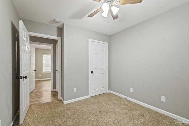 3985 Whitehall Dr, Pace, FL 32571 - unfurnished bedroom featuring carpet flooring, a ceiling fan, and baseboards