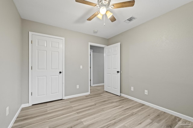 3985 Whitehall Dr, Pace, FL 32571 - unfurnished bedroom with light wood finished floors, baseboards, visible vents, and a ceiling fan