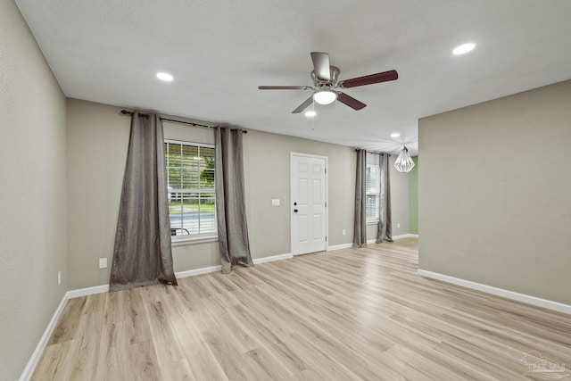 3985 Whitehall Dr, Pace, FL 32571 - unfurnished room with baseboards, ceiling fan, and light wood-style floors