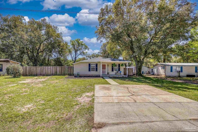 3985 Whitehall Dr, Pace, FL 32571 - view of front facade with a front lawn, fence, and a porch