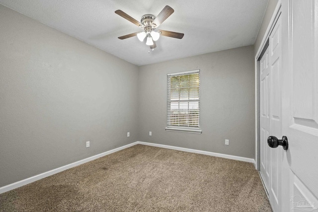 3985 Whitehall Dr, Pace, FL 32571 - unfurnished bedroom featuring baseboards, a textured ceiling, carpet floors, a ceiling fan, and a closet
