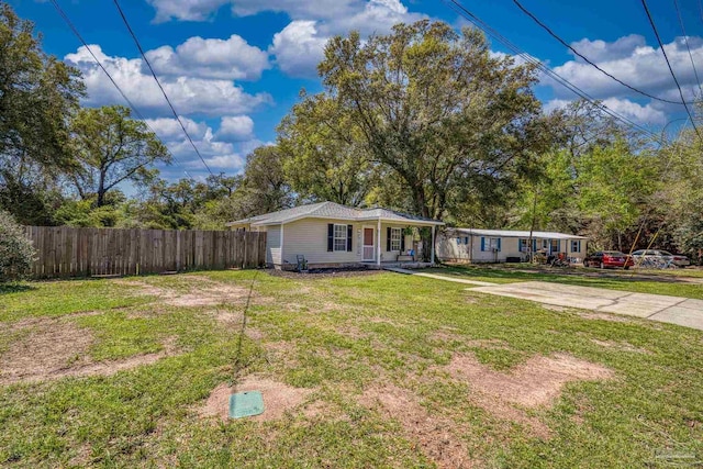 3985 Whitehall Dr, Pace, FL 32571 - ranch-style home with fence, a porch, and a front yard