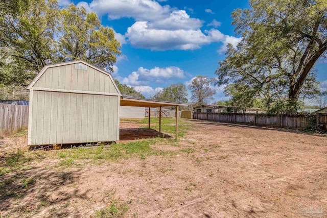 3985 Whitehall Dr, Pace, FL 32571 - view of yard featuring a fenced backyard, a shed, and an outdoor structure