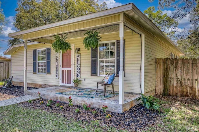 3985 Whitehall Dr, Pace, FL 32571 - view of front of property featuring covered porch and fence