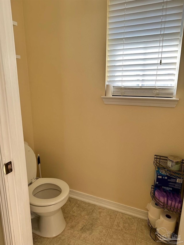 bathroom featuring tile patterned flooring and toilet