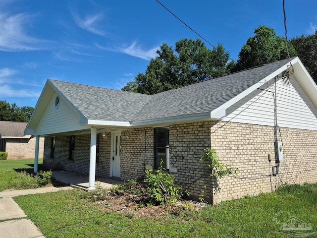 5757 Melrose Dr, Milton, FL 32570 - view of side of property with brick siding and a shingled roof