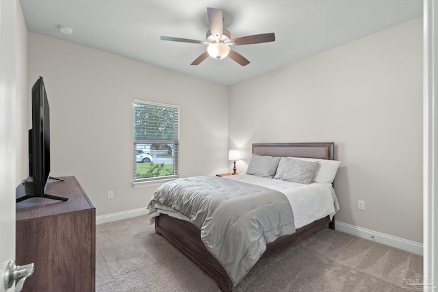 bedroom featuring carpet flooring, baseboards, and a ceiling fan