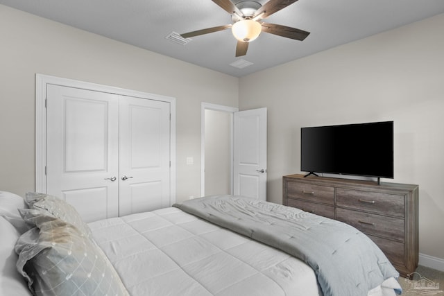 bedroom featuring a closet, a ceiling fan, carpet flooring, and baseboards