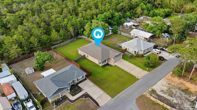 aerial perspective of suburban area featuring a forest