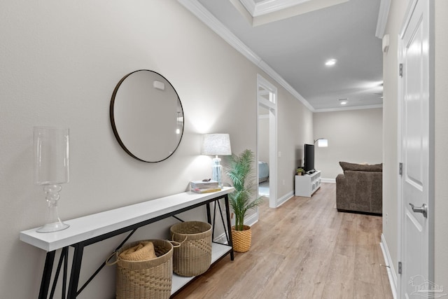 corridor featuring crown molding, light wood-style flooring, recessed lighting, and baseboards
