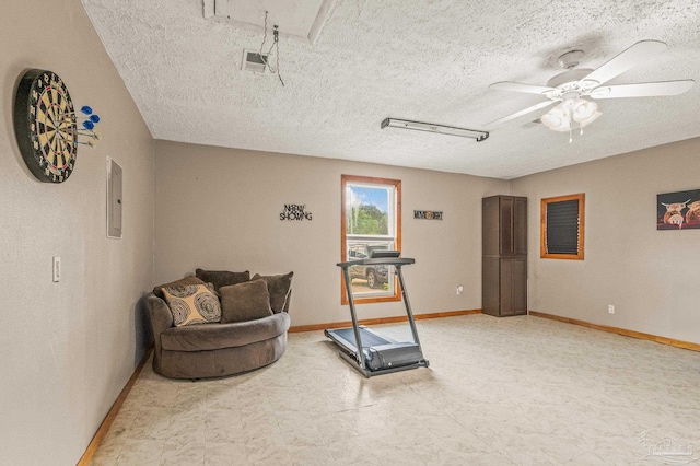2762 Christine St, Pensacola, FL 32526 - workout area with tile patterned floors, a textured ceiling, a ceiling fan, and electric panel
