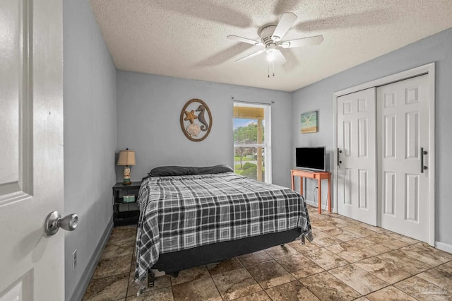 2762 Christine St, Pensacola, FL 32526 - bedroom featuring a textured ceiling, a closet, and a ceiling fan
