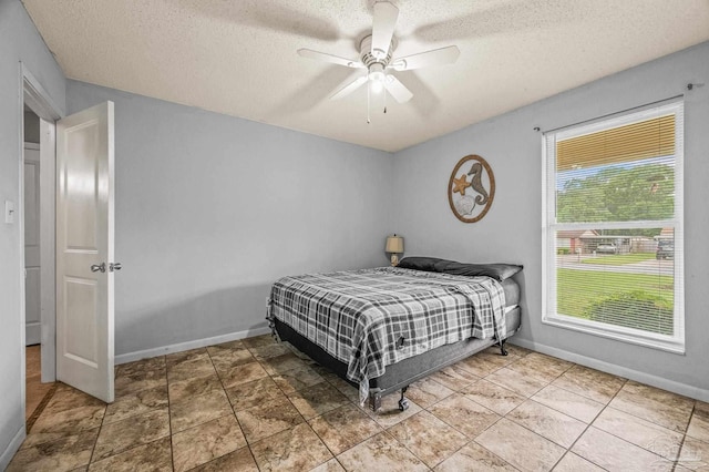 2762 Christine St, Pensacola, FL 32526 - bedroom with a textured ceiling and a ceiling fan
