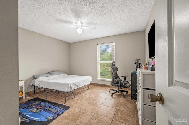 2762 Christine St, Pensacola, FL 32526 - tiled bedroom with a textured ceiling and ceiling fan
