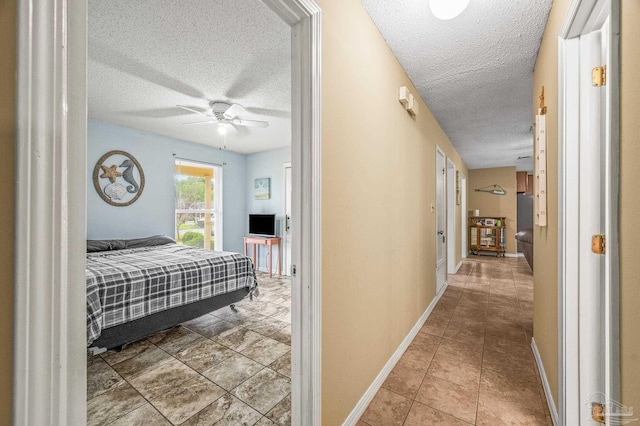 2762 Christine St, Pensacola, FL 32526 - bedroom with a textured ceiling, tile patterned floors, and ceiling fan