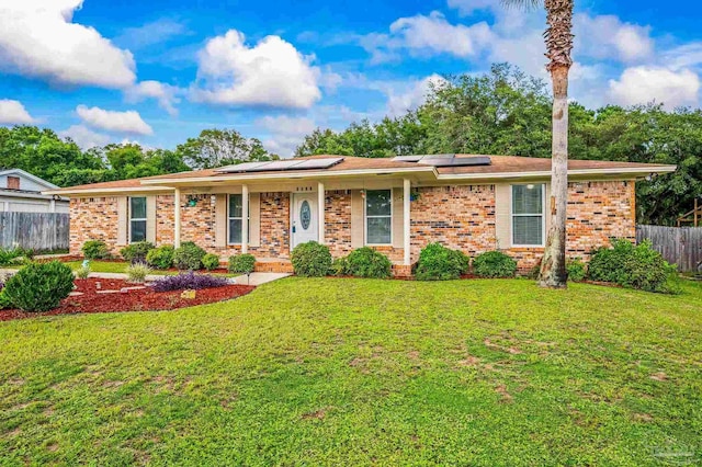 2762 Christine St, Pensacola, FL 32526 - single story home featuring brick siding, solar panels, and a porch