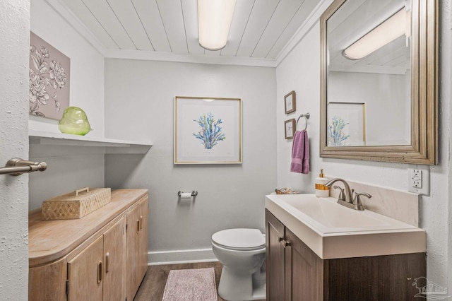 1220 E Cervantes, Pensacola, FL 32501 - half bath with vanity, toilet, wood finished floors, baseboards, and crown molding