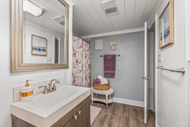 1220 E Cervantes, Pensacola, FL 32501 - full bathroom featuring wood finished floors, vanity, crown molding, toilet, and wood ceiling