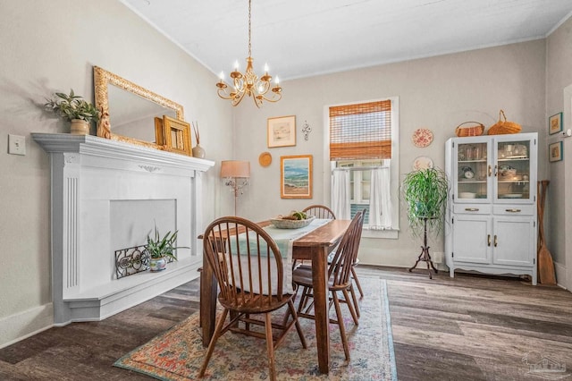 1220 E Cervantes, Pensacola, FL 32501 - dining space featuring wood finished floors, a chandelier, ornamental molding, baseboards, and a fireplace with raised hearth