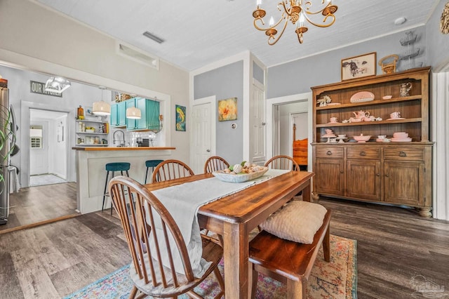 1220 E Cervantes, Pensacola, FL 32501 - dining space featuring a chandelier and dark wood-type flooring