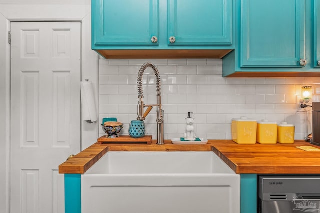 1220 E Cervantes, Pensacola, FL 32501 - kitchen with wooden counters, blue cabinetry, a sink, and tasteful backsplash