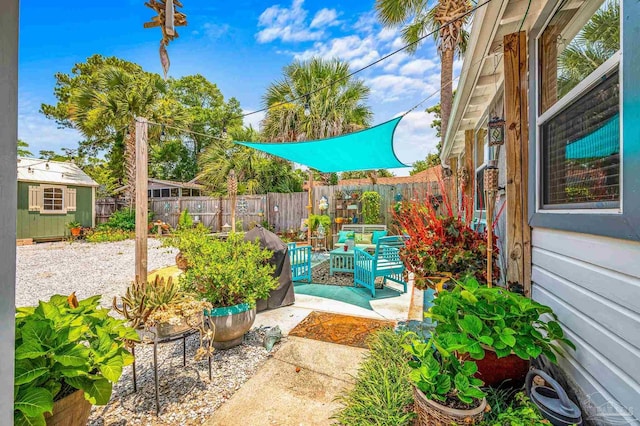 1220 E Cervantes, Pensacola, FL 32501 - fenced backyard with a patio and an outdoor structure