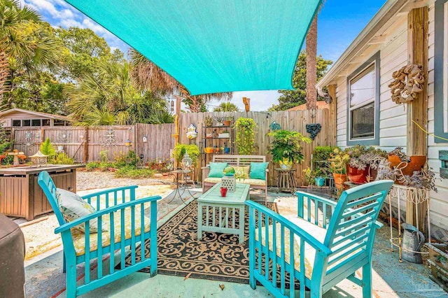 1220 E Cervantes, Pensacola, FL 32501 - fenced backyard with a patio and an outdoor hangout area